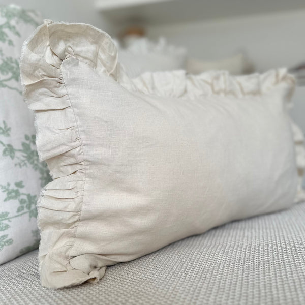 Showing a close up of the corner of Rectangle Cream Ruffled Edge Linen Cushion 